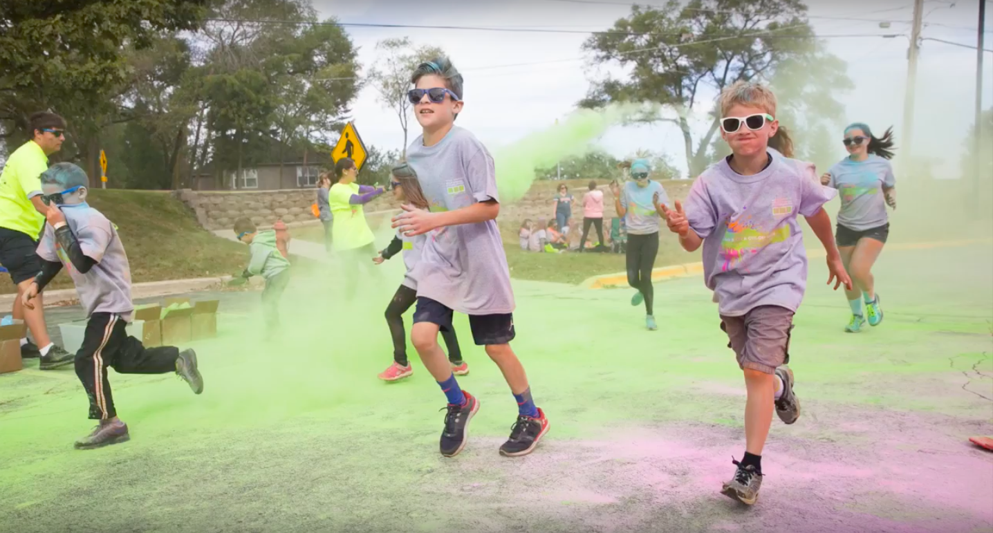 Elementary schoolers dash through colorful powder during last year's Bears on a Color Run. The coordinators of the event hope to draw an even bigger crowd this year.