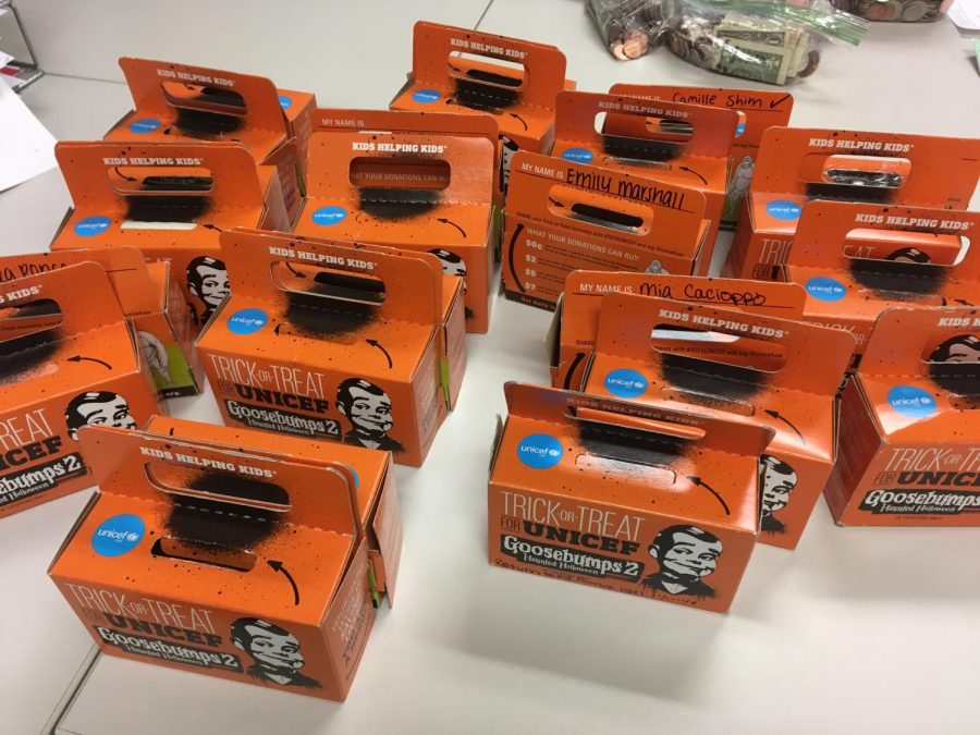 The+orange+%E2%80%9Ctrick-or-treat%E2%80%9D+boxes+that+students+collected+money+in+as+part+of+UNICEFS+first+fundraiser.+Profits+from+fundraisers+like+these+will+go+towards+helping+UNICEFS+cause.