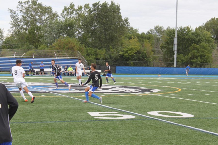 A Boys Soccer player goes for the ball. The team had a successful season this year, according to Eric Bibb, junior, but they hope to do even better next year.