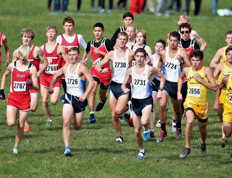 Boys Cross Country members take off at the start of a race. The boys made it to state and placed 23rd.