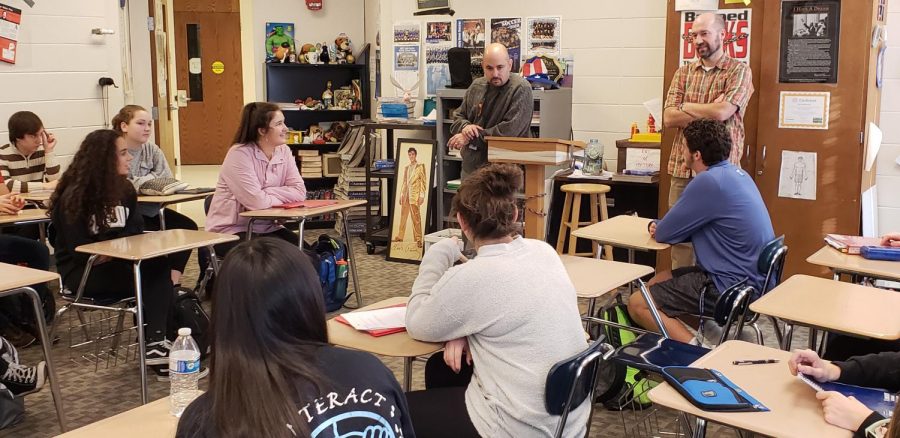 Teachers Ian Silverman and Michael Schmitz lead their American Studies class. The co-taught and double-period class makes American Studies a unique  opportunity and one that is too bad to take away from students, Silverman said.