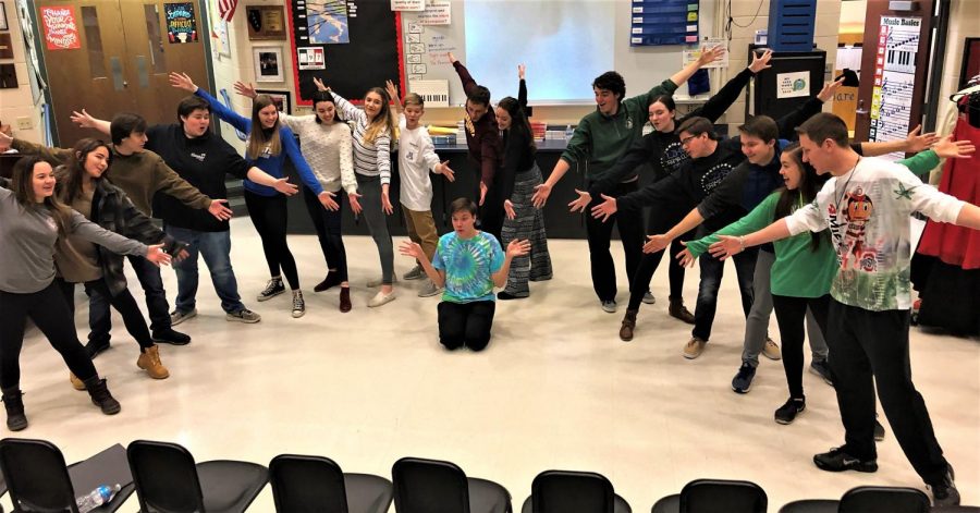 Bare Voices strikes an ending pose as they rehearse for their holiday performances. According to Nick Juknelis, Bare Voices teacher, it is this valuable practice time that allows the gorup to spread goodwill around the community.