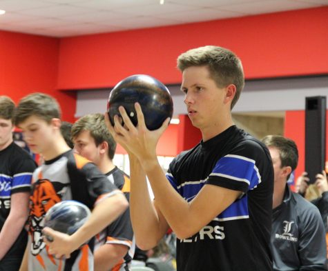 Jason Czabaj, senior, prepares to take a shot in a match. Competitive bowling requires a skill and focus some people may not recognize, according to Schnur.