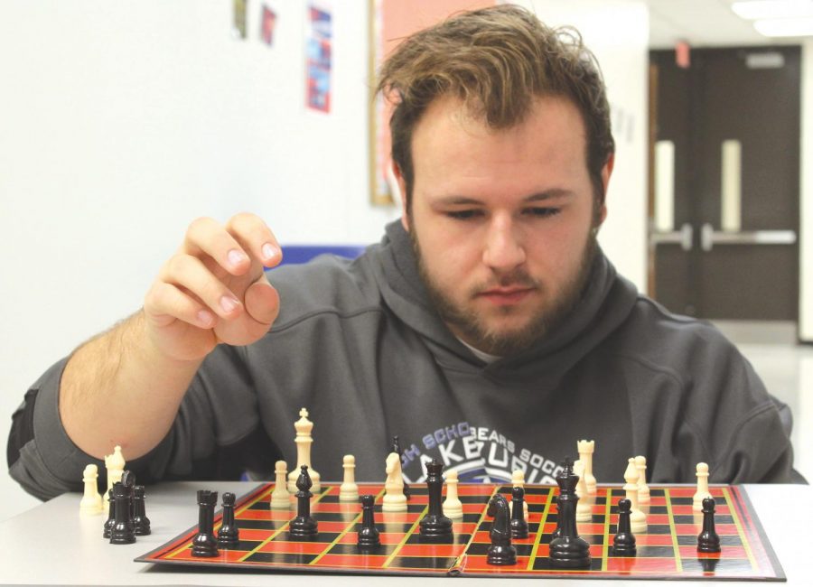 Robert Mepham, senior, thinks through his next chess move.  For him, the game is a mental challenge that he enjoys and that keeps his mind sharp.