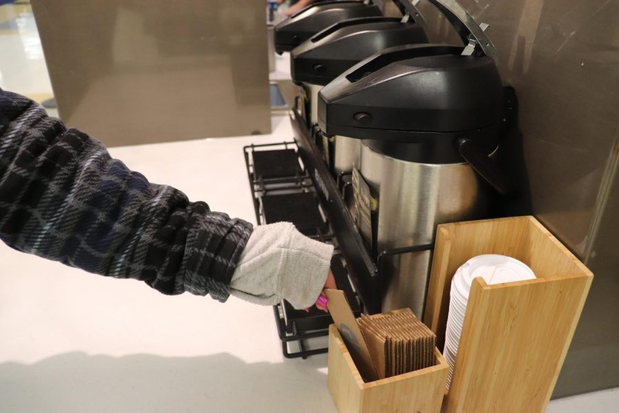 Max Feldman, sophomore., grabs a coffee thing. He says that he often needs to rush to get back to class after getting Jazzmans.