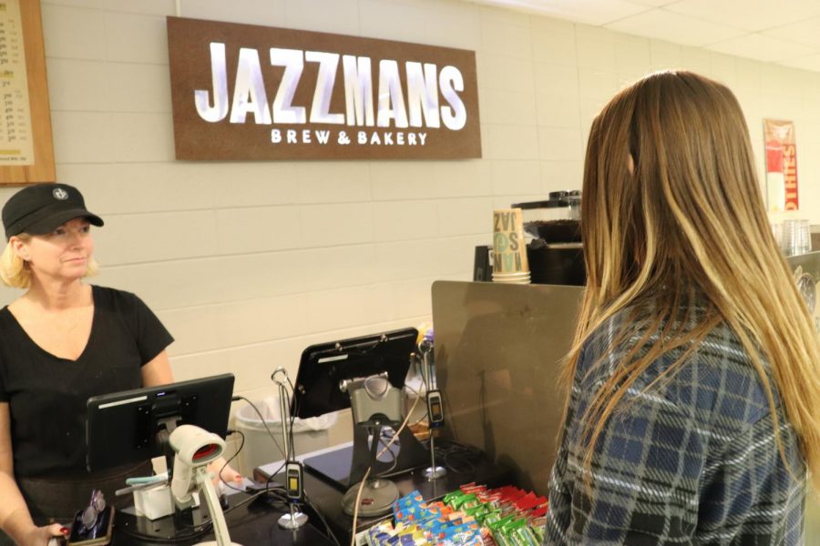 Carly Schwichtenberg, sophomore, orders at the Jazzmans counter. Students say that jazzmans could become more efficient if one worker takes an order and another makes the drink.