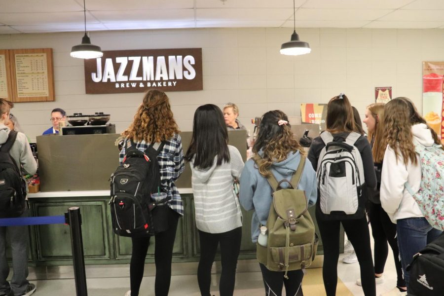 Students wait for their specialized coffee drinks in the morning. Many students say that these complex drink orders can hold up the line and cause irritation among Jazzmans customers.