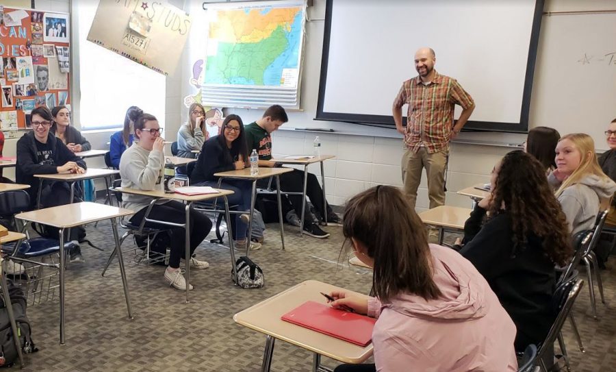 Current American Studies students takes notes during a lecture. The class offers a unique approach to learning, which some believe is being thrown away in the schools push for more APs.