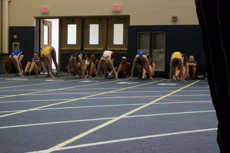 A couple members of the girls track team prepare to start their race at the Lyons Invite on February 9. The team this week will prepare to compete in the Wheeling Invite on February 23. 