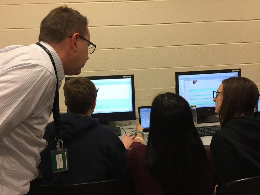 Dan Ellis, math teacher, mentors his multivariable calculus students. The dual credit class offers a different teaching approach, shifting from a lecture style class to one that is more collaborative.