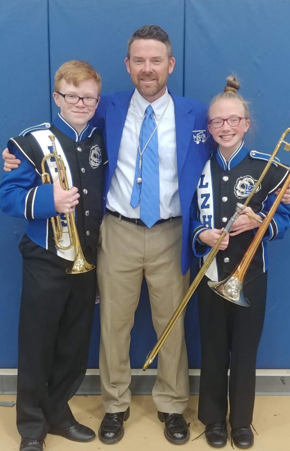 The Thompson family holds a strong love and passion for music. (From left to right) J.T. Thompson, junior; Josh Thompson, band director; and Kate Thomson, freshmen, come together as a family to perform their music. 