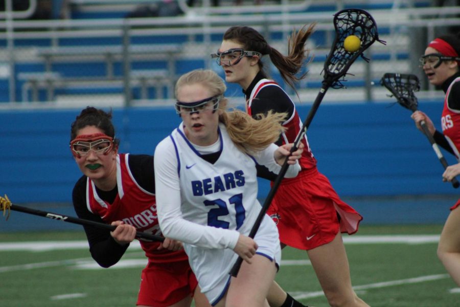 Maddie Kosir, junior, attempts to get past a Deerfield player in last weeks 2-1 loss. The team now will prepare to bounce back and put a tally in the win column