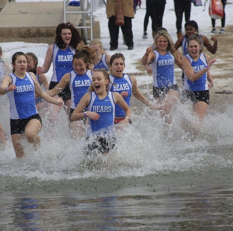 Girls Track and Field members plunge into Lake Zurich. The team was just one of many LZHS organizations that supported the annual event which raised money for Purple Plunge, a nonprofit.