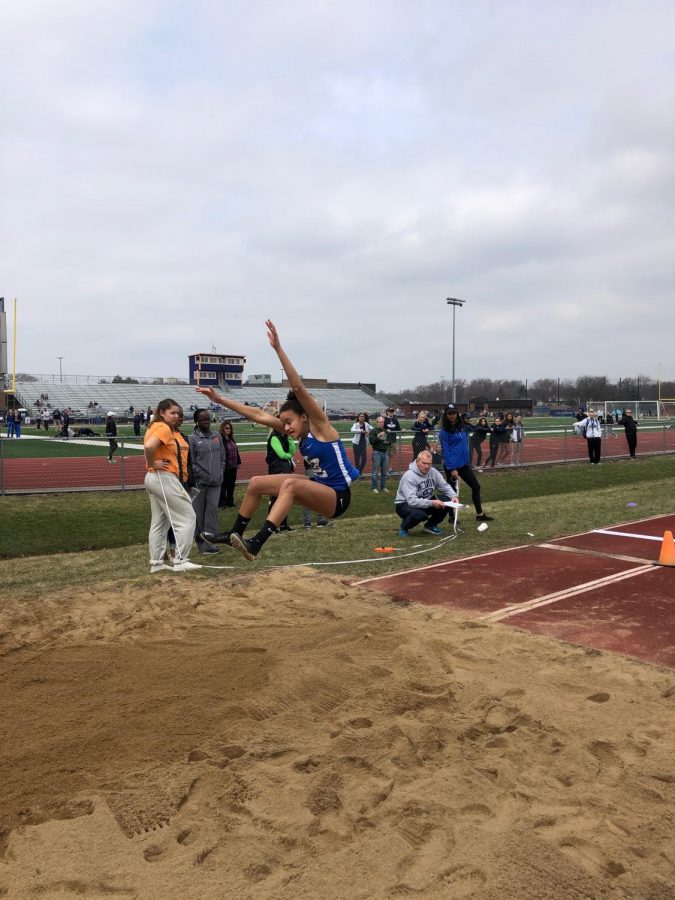 Nikki Skoby, senior, competes in the long jump at the Buffalo Grove Invitational. Skoby took fourth in the event, and the team took second place overall at the invite.