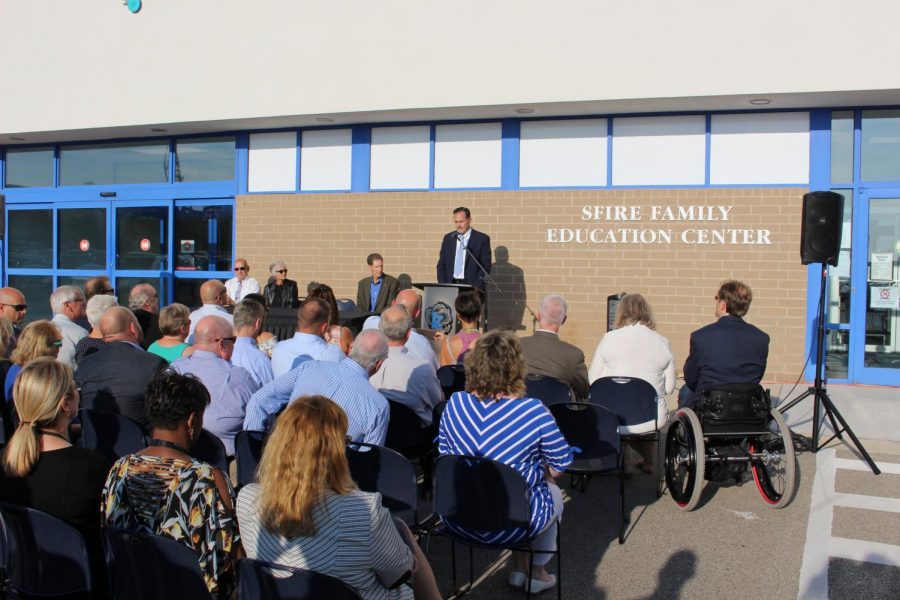 The superintendent speaks in front of a community audience. Osburn is always active in discussing district wide policies with parents and community members regularly.