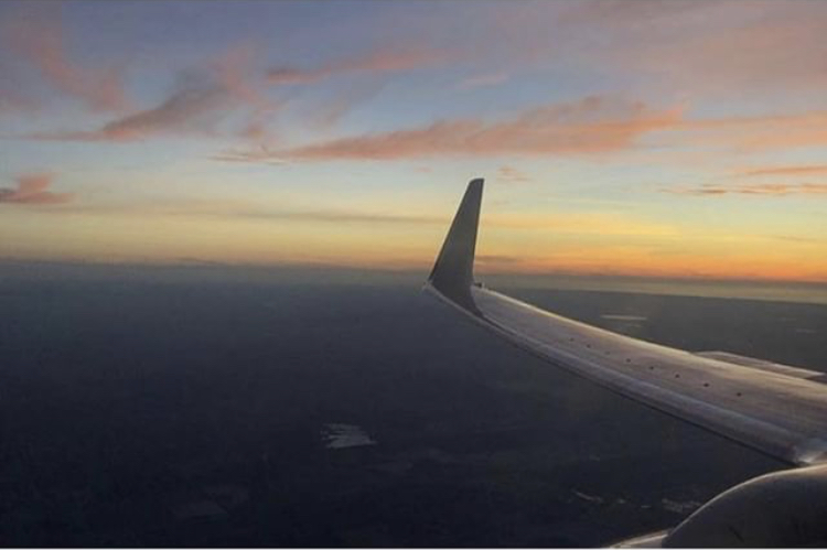 Kiana Pouyat, freshmans view of a sunset through a  plane window. For Pouyat and many other LZHS students, plane rides are a common occurrence, but not all students get to experience air travel.