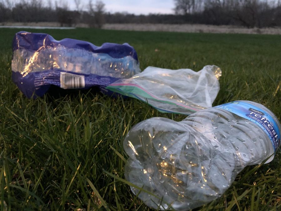 Plastic and litter sits on a lawn in Lake Zurich. Even in local communities, students have ways to clean up the planet, as evidence of pollution is oftentimes right outside their front door, according to Gyarmaty.