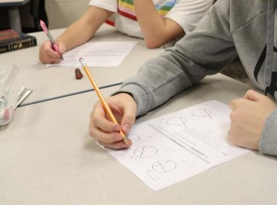 Margaret Koy, math teacher`s students practice new problems in class. When students ask why they learn something, "I don`t want to be saying, `Well, if you do this job, then you`re going to do this,` and then they inevitably say, `That`s not what I want to do, so why does it matter?`" Koy said.