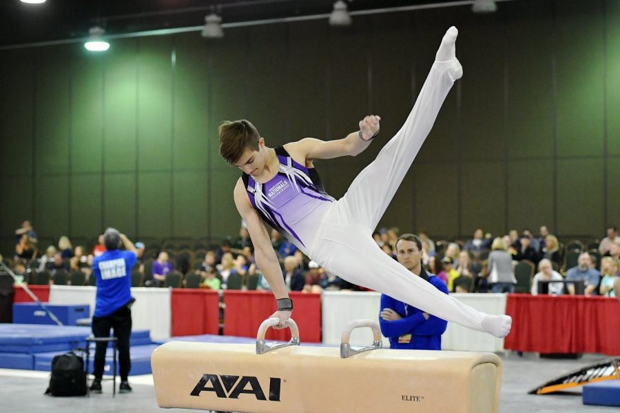Cooper Giles, senior gymnast who practices at Premier Gymnastics down in Downers Grove. Giles has to drive an hour to commute to his facility directly after school, doing homework at the gym just to fit everything in, according to Giles. 