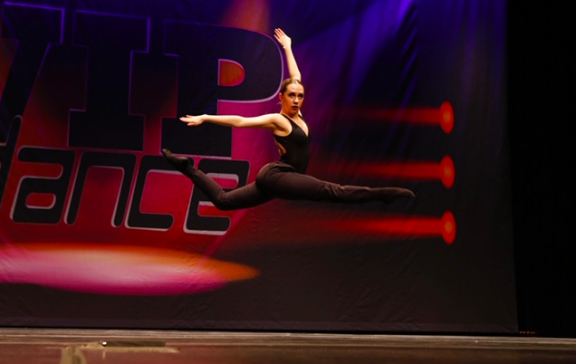 Mia Witt, junior, is seen here performing a piece at a dance competition. Witt first fell in love with dance when she was very young.