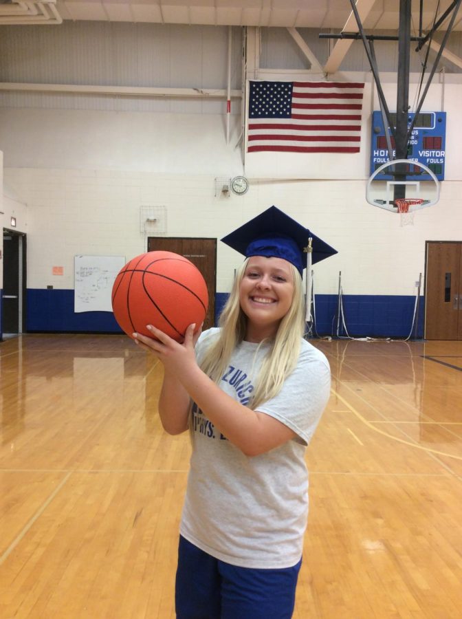 Isabelle Ostrowski, senior, shoots a smile towards the camera. Ostrowski is part of many volunteer programs dedicated to helping children with special needs achieve their best.