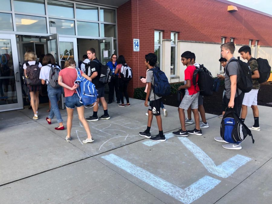 Students strolling into the first day of school. The first day of school was August 21.