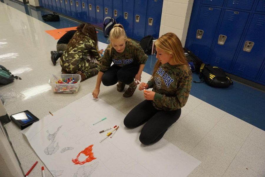 Two LZ 19 graduates decorating for a past homecoming. This year, unlike previous years, all decorating for homecoming will take place on one Sunday. 