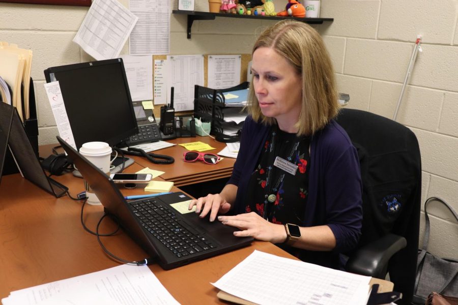 Mckenna Serowka working at her desk at the high school. This school year she is taking on the workload of science department chair.