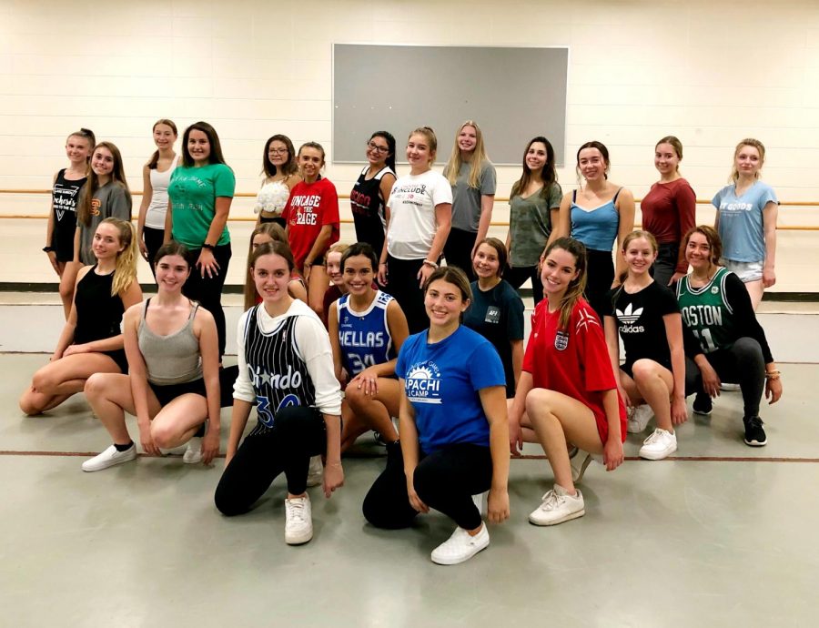 The Orchesis team poses for a photo during a rehearsal. “[Orchesis is] a place where you can put yourself and your dancing out there, and not have other people get into your feelings,” Emily Rosenfeld, senior and Orchesis president, said. “I wish more people would dance so they could experience this type of creativity and this outlet.”