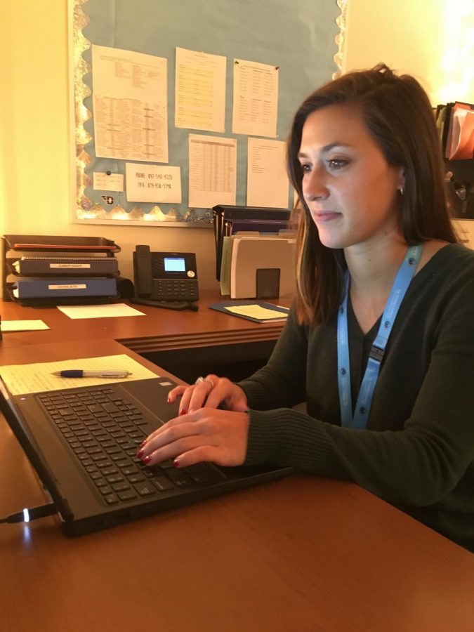 Levato often works on her computer responding to students and staff through email.