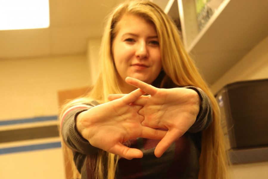 Olivia Noland, junior, cracks her kunckles in an attempt to relieve stress. I dont crack my knuckles often, but it is satisfying when I do crack them.