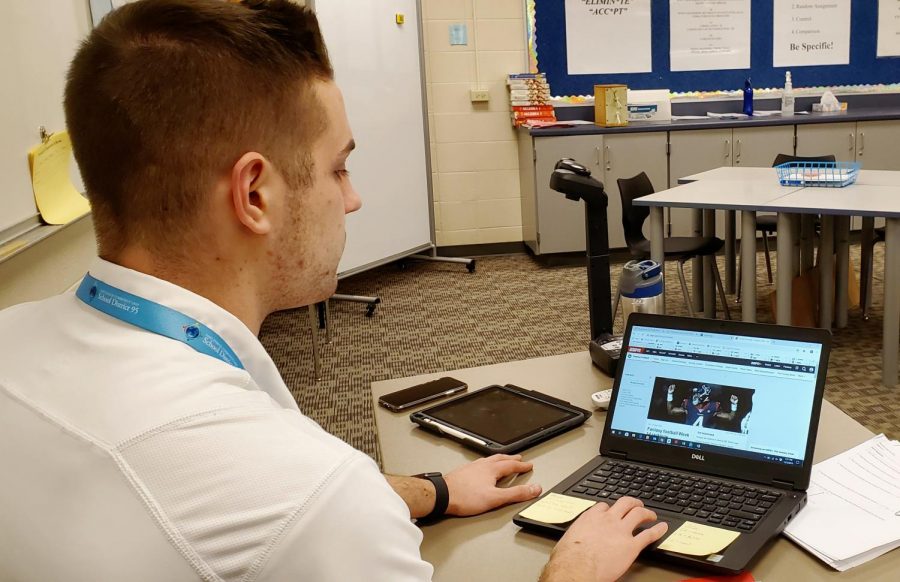 Timothy Beranek, math teacher, checks the fantasy football statistics during a free period. [Fantasy football] gives me a reason to actually want to watch more sports and just piques your interest,” Beranek said, “so youre not just interested in your favorite team, but youre interested in every game that goes on. It definitely helps me learn more about the game and whos good, and kind of dive into a little bit more.”