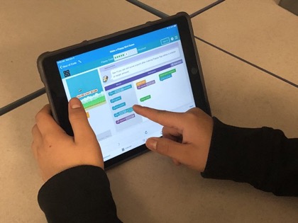 Students code interactive activities during the Hour or Code. Heltzel believes coding is beneficial for students.