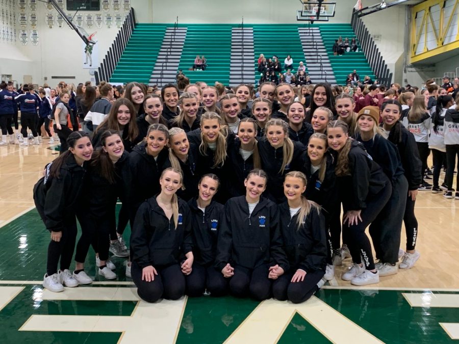 The Poms team stands together after winning first place at the Stevenson Invite. The Poms team has high expectation after returning as State Champions for two consecutive years. 