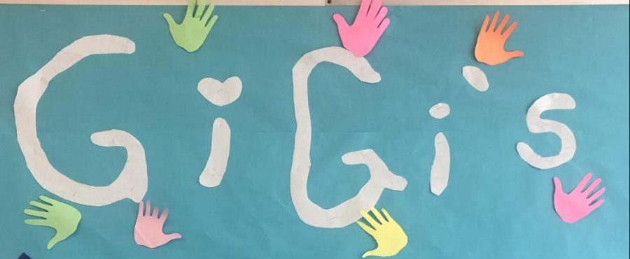 The Gigis Playhouse sign in the cafeteria imitates the Gigis Playhouse logo. Gigis Playhouse provides free educational development programs for individuals with Down syndrome.