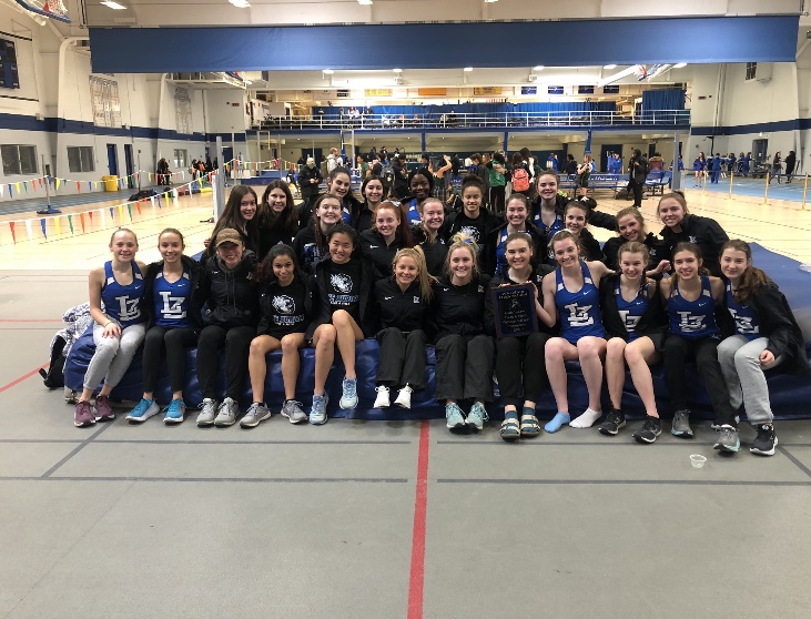 The Girls Track and Field team stands together after the Wheeling Meet on February 29. The team won the meet with a score of 88.5