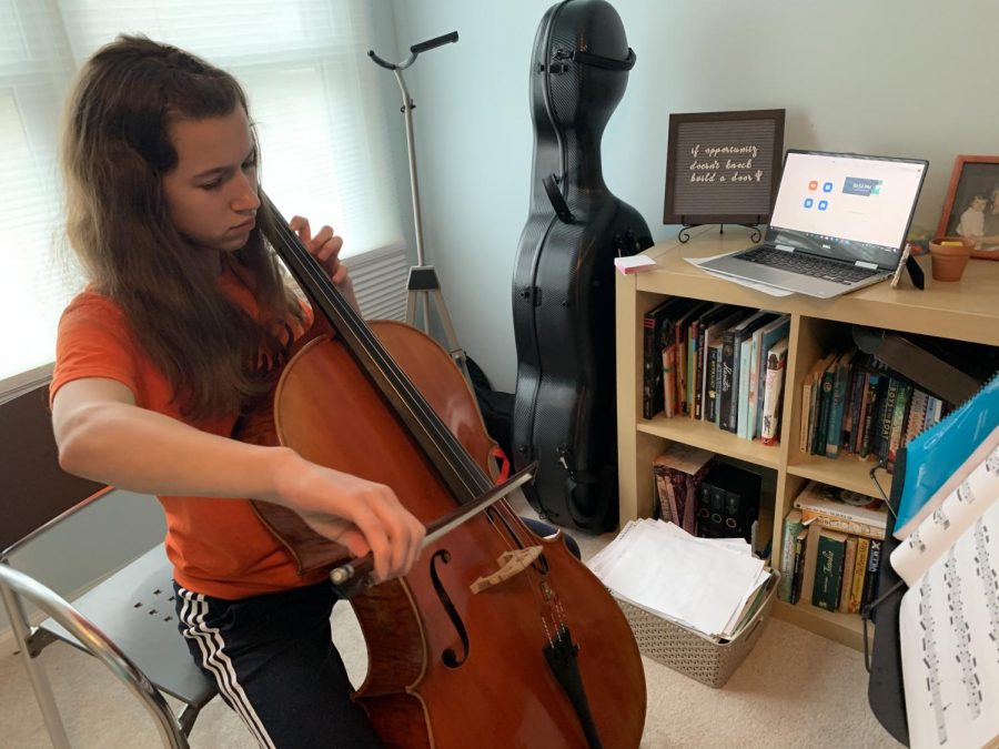 Due to social distancing, music students at home have been doing private lessons remotely at home. Louisa Hagen, freshman, prepares to video chat with her teacher through Zoom right before her private lesson.  