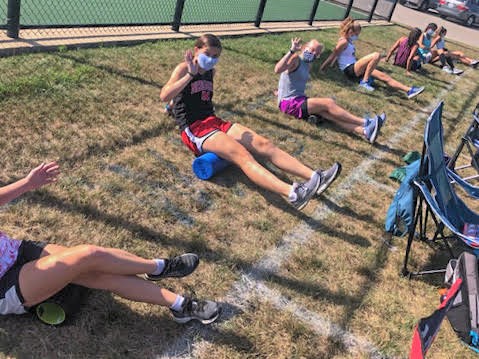 Girls on the cross country team are assigned their own squares that they must stay in when not running in order to effectively stay six feet apart from each other. According to Jeremy Kauffman, Head Girls Cross Country Coach, these regulations are important as they allow the girls to have a season at all.