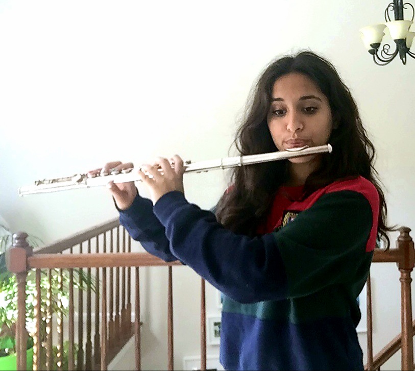 Sanya Ahuja, sophomore band member, practices playing her flute to prepare for the ILMEA audition. “Im big on competing for things and I try to compete for as many opportunities as I can,” Ahuja said. ‘I feel like [ILMEA is] really gives me the broader idea of, Wow, theres so many things we can do with band!’ I really wanted to take advantage of the fact that I could be chosen for something bigger than just Lake Zurich band.”