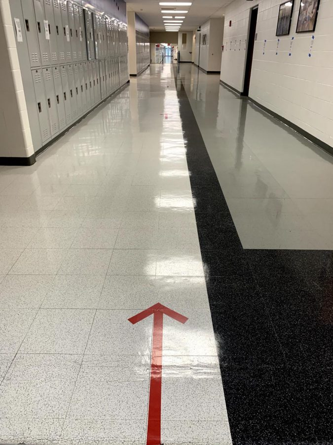 Hallways such as the S-Hallway shown here have been sanctioned off as a one-way hallway for hybrid learners. Other hallways have been divided into two sides in order to promote social distancing.