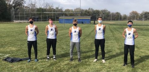 The boys cross country team, posing after a successful conference meet. Despite COVID-19 limitations, the team was able to persevere through for a state finish.