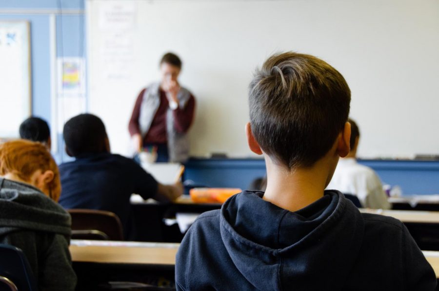 A student sits in a classroom that is led by a teacher. Although teachers are the ones who educate the youth, students often offer valuable learning experiences and new perspectives for teachers.