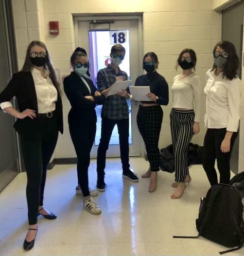 Brittany Rogus, senior, (far left) and her friends before a choir audition. Rogus says that extracurriculars such as choir and theater are so much more meaningful as a five-day senior.