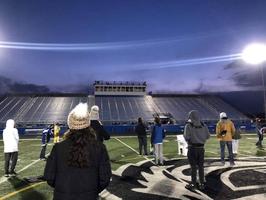 The marching band prepares for their Homecoming halftime performance on Wednesday, April 21.