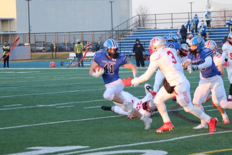 Jack Dwyer, senior, breaks for the edge against Mundelein. The team was able to finish their spring season with a 3-3 record and 3 shutout victories.