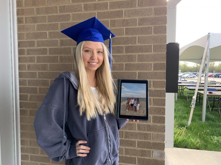 Lauren Polsdorfer, senior, with a picture of her family in North Carolina. She will be moving to North Carolina after graduation to be with her sister. 