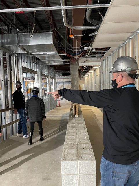 Ryan Rubenstein, assistant principal, (right) points out the new  construction updates that have been in  progress beginning on March 1.