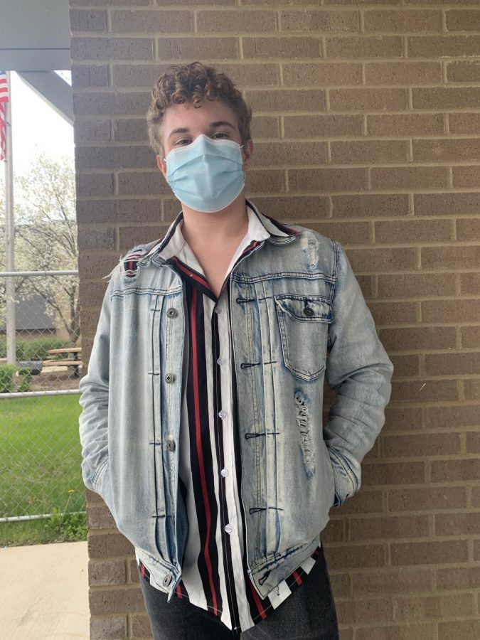 Matthew Shaw, junior, in his favorite thrifted item: his jean jacket. Shaw says thrifting is something everyone should try at least once.