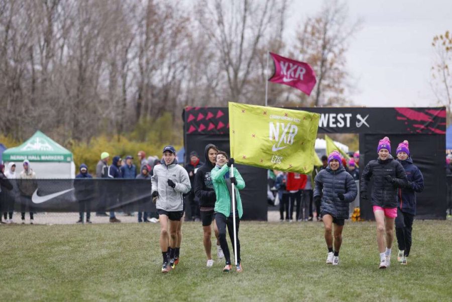 Seven members of the boys cross country team (pictured at the starting line) and two members from the girls team competed in the NXR race last month. The boys placed 5th for the Midwest; junior Brooke Johnston placed 8th individually. 