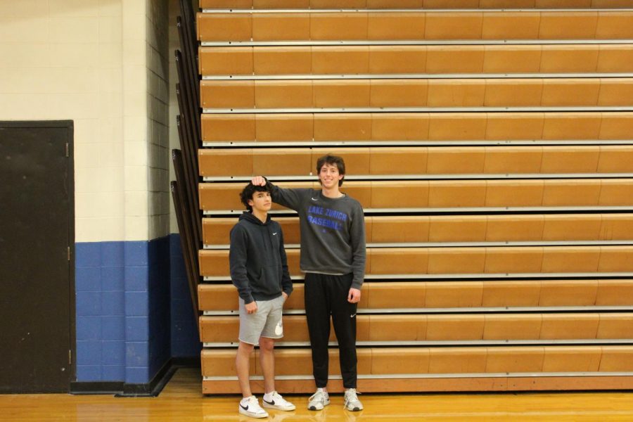 Ben Elias and his fellow teammate on the basketball team show their visible height difference
